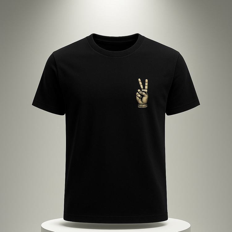 Black t-shirt with a peace sign design on a white pedestal against a gray background