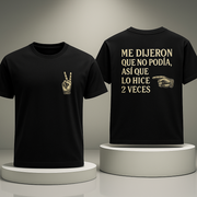 Black t-shirt with text and graphic design on a gray background