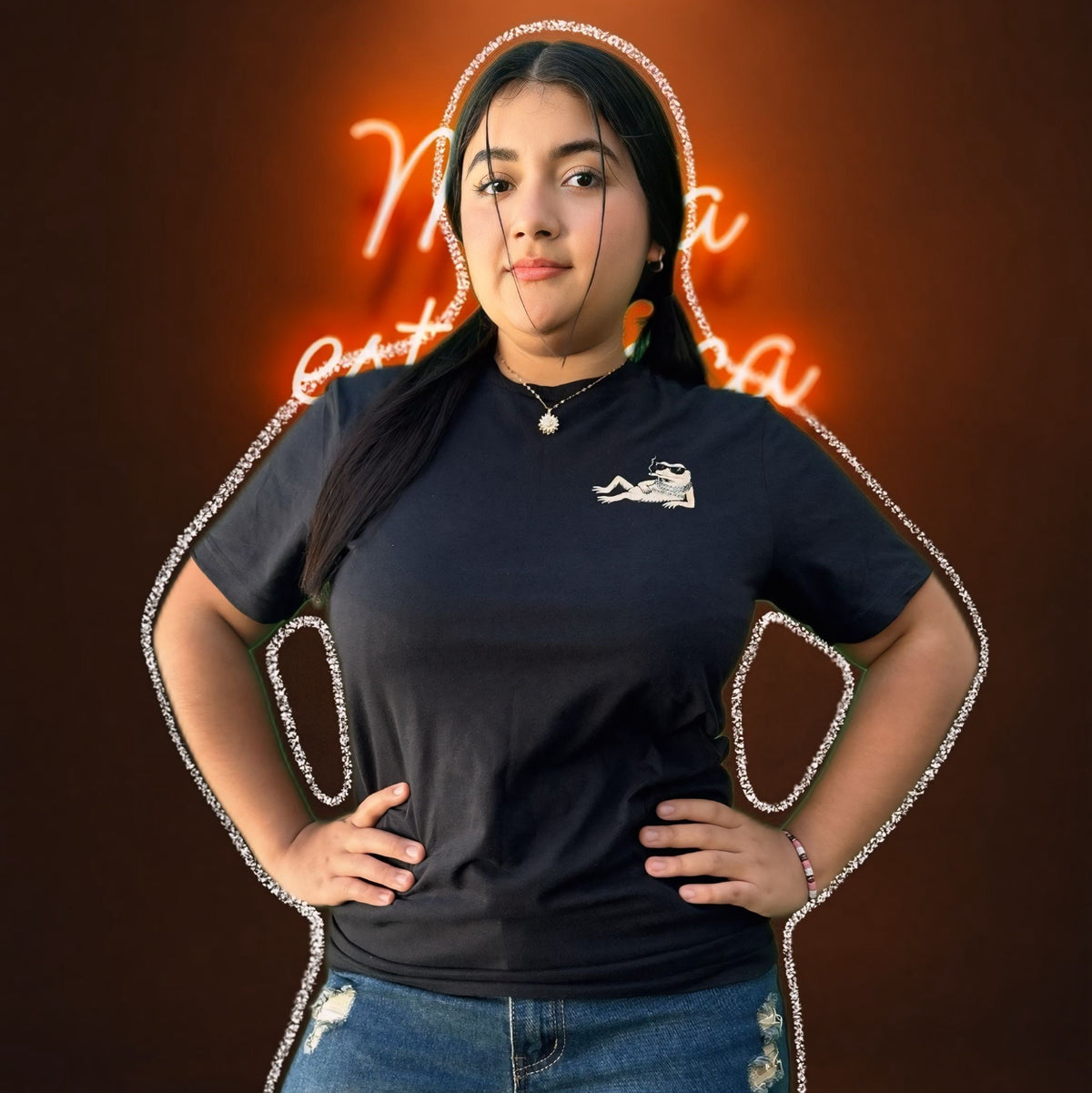 Person wearing a black t-shirt with a logo against a dark background
