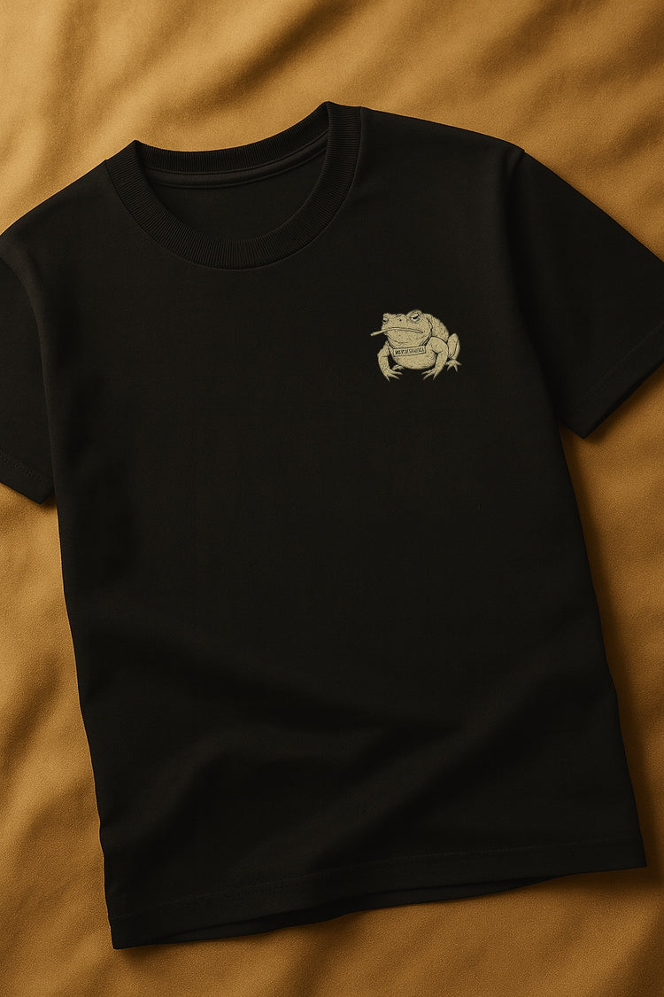 Black t-shirt with a white graphic on a brown background