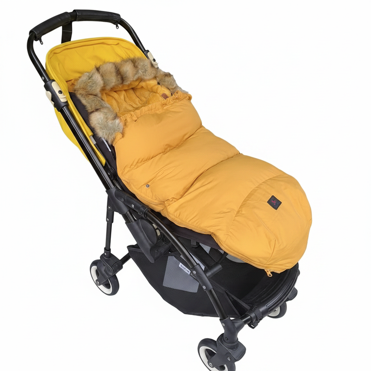 Baby stroller sleeping bag mustard yellow with faux fur trim, white background